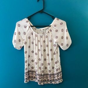 Cute over the shoulder sheer shirt.